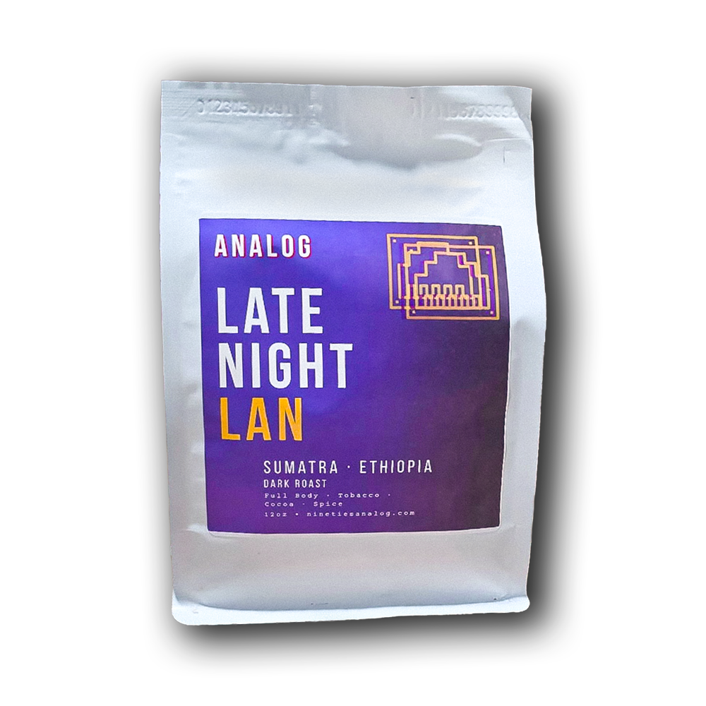 A  bag of Analog Late Night Lan coffee, featuring a prominent purple label with white and yellow text, set against a plain white background with a soft drop shadow.