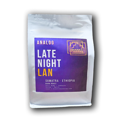 A  bag of Analog Late Night Lan coffee, featuring a prominent purple label with white and yellow text, set against a plain white background with a soft drop shadow.